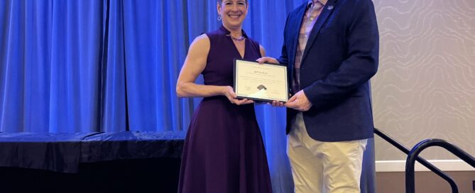 MFA Board Chair Charlene Clark handing a certificate to Jeff Newkirk.