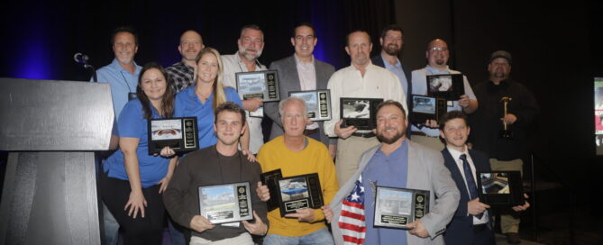 Winners of the 2026 MFA Fabrication Excellence Awards pose with plaques.