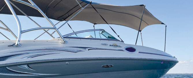 A SunDeck boat on the water.