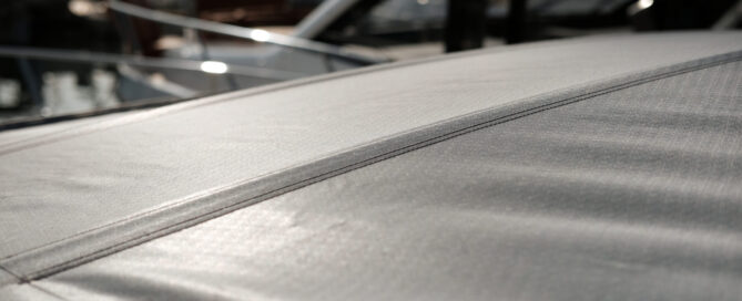 Close-up of a retractable roof made from Stamoid Light fabric, overlooking boats.