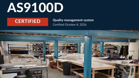 Certification announcement featuring a blue and red layout with text highlighting ISO 9001:2015 and AS9100D, emphasizing quality and craftsmanship.